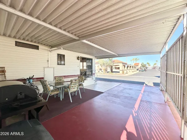a view of a street with seating area