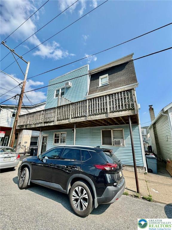a car parked in front of a house