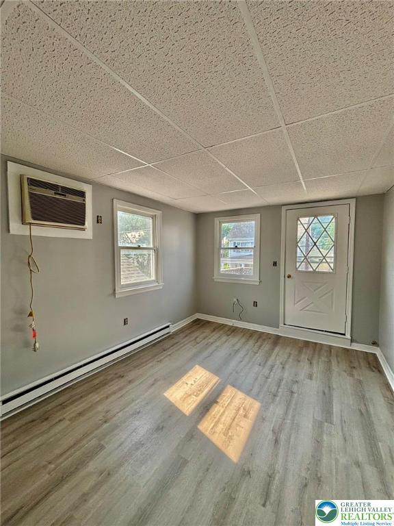 210 West Main Street Pen Argyl, PA 18072 - Photo 15 of 21 an empty room with wooden floor and windows