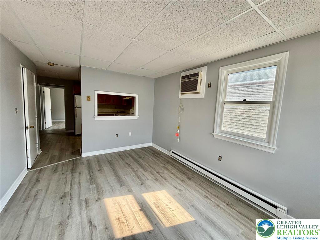 210 West Main Street Pen Argyl, PA 18072 - Photo 16 of 21 a view of empty room with wooden floor