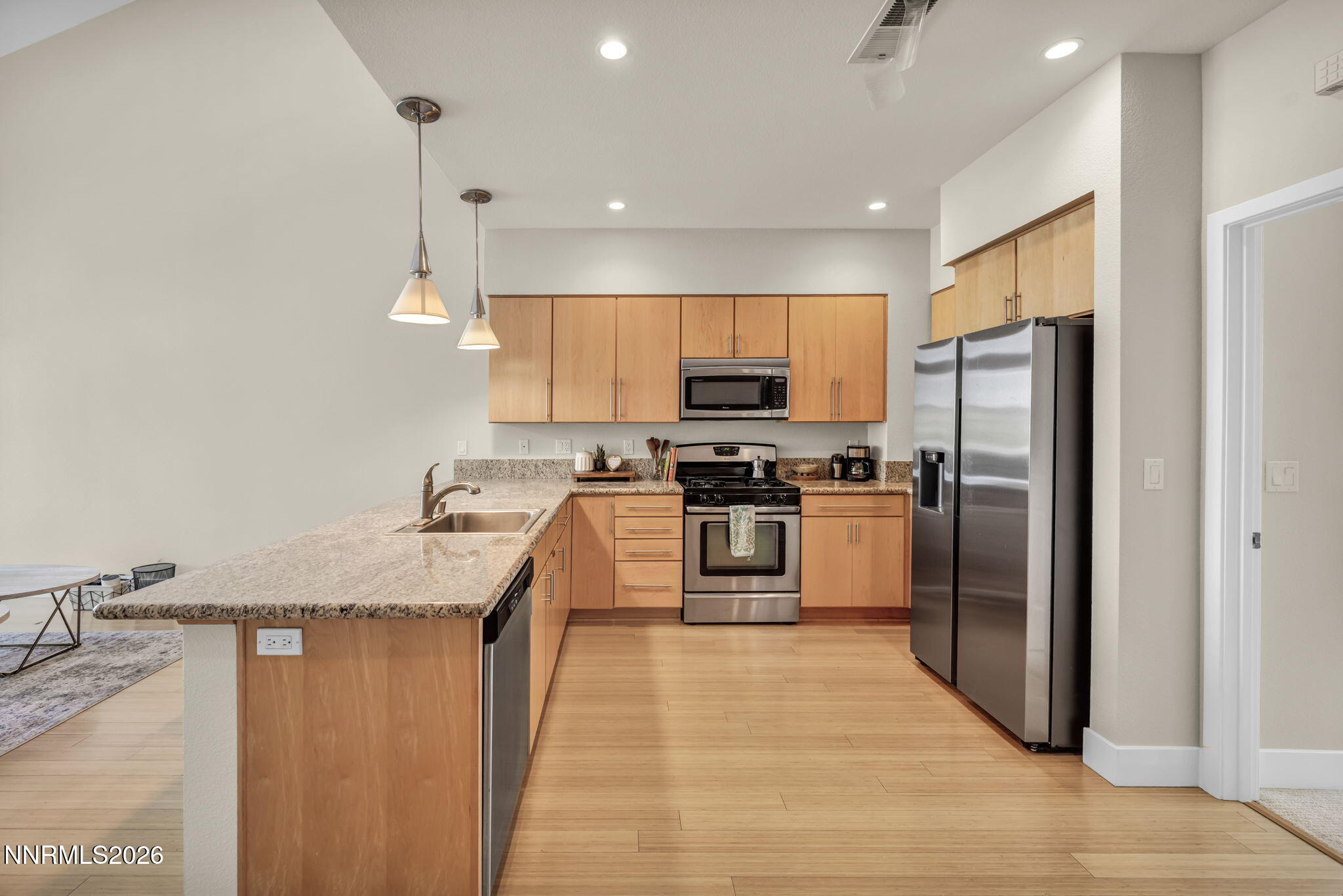 326 State Street Reno, NV 89501 - Photo 20 of 49 a kitchen with stainless steel appliances granite countertop a refrigerator a stove a sink and a microwave