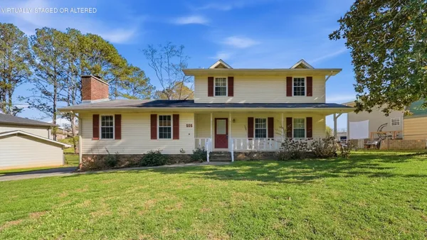 a front view of a house with a yard