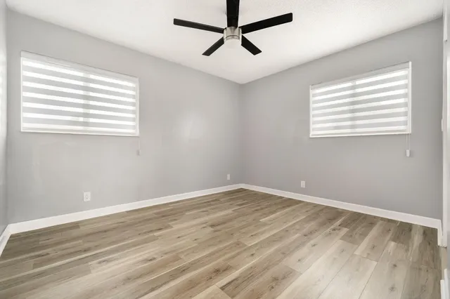 a view of room with hardwood floor and window