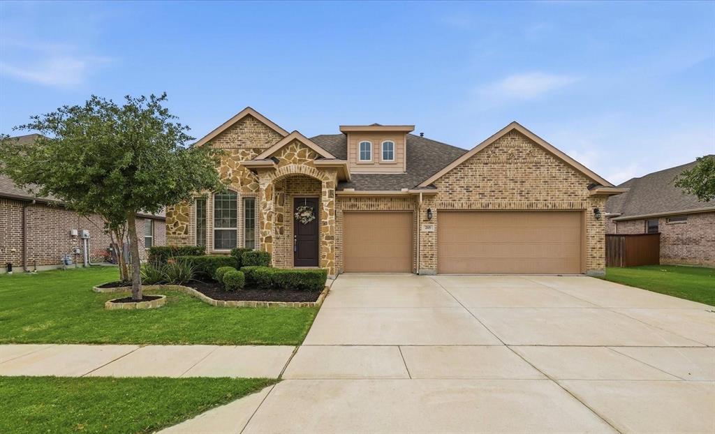 215 Equestrian Road Hickory Creek, TX 75065 - Photo 1 of 36 a front view of a house with garden