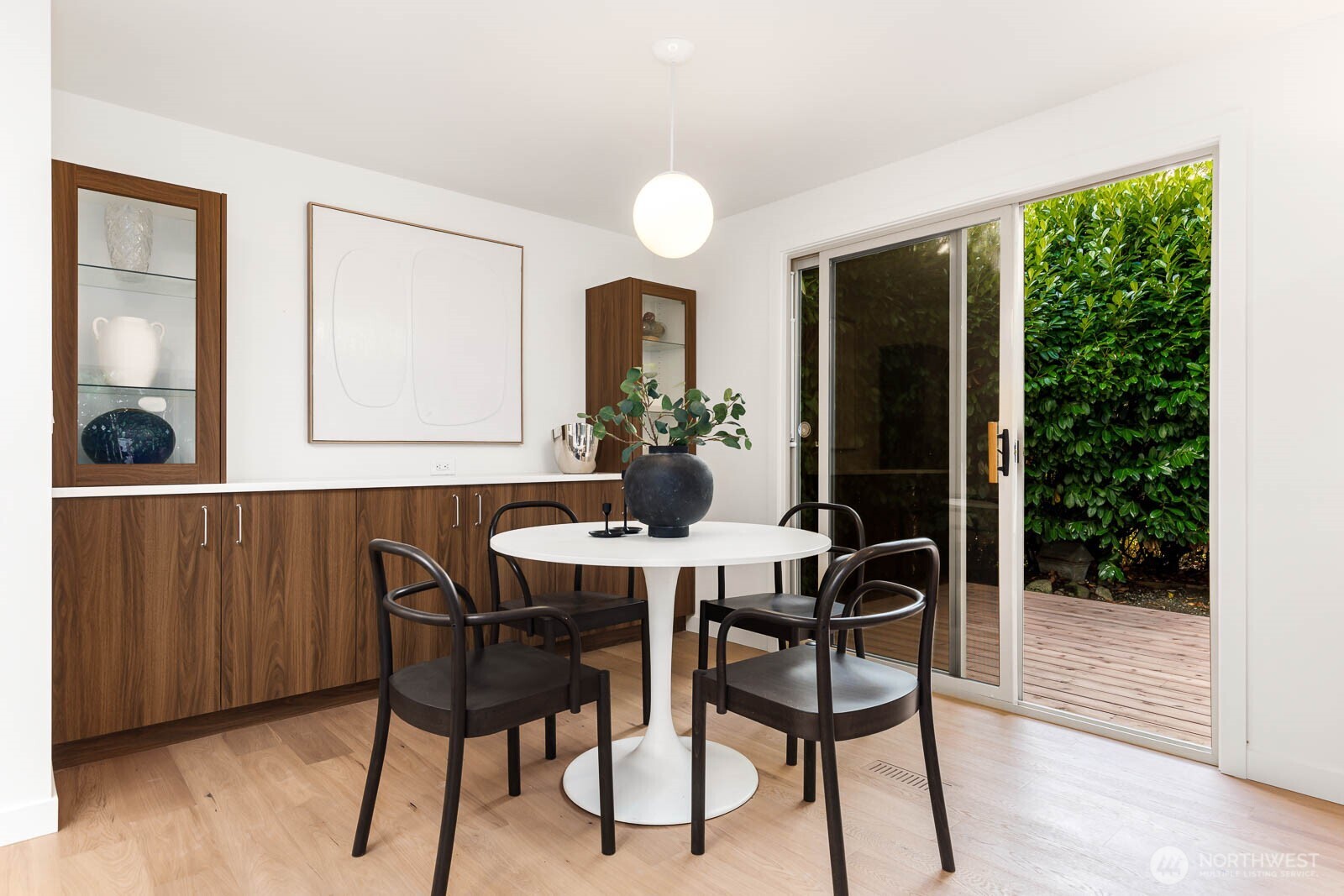 19425 Hollyhills Drive Northeast Bothell, WA 98011 - Photo 12 of 26 a view of a dining room with furniture and wooden floor