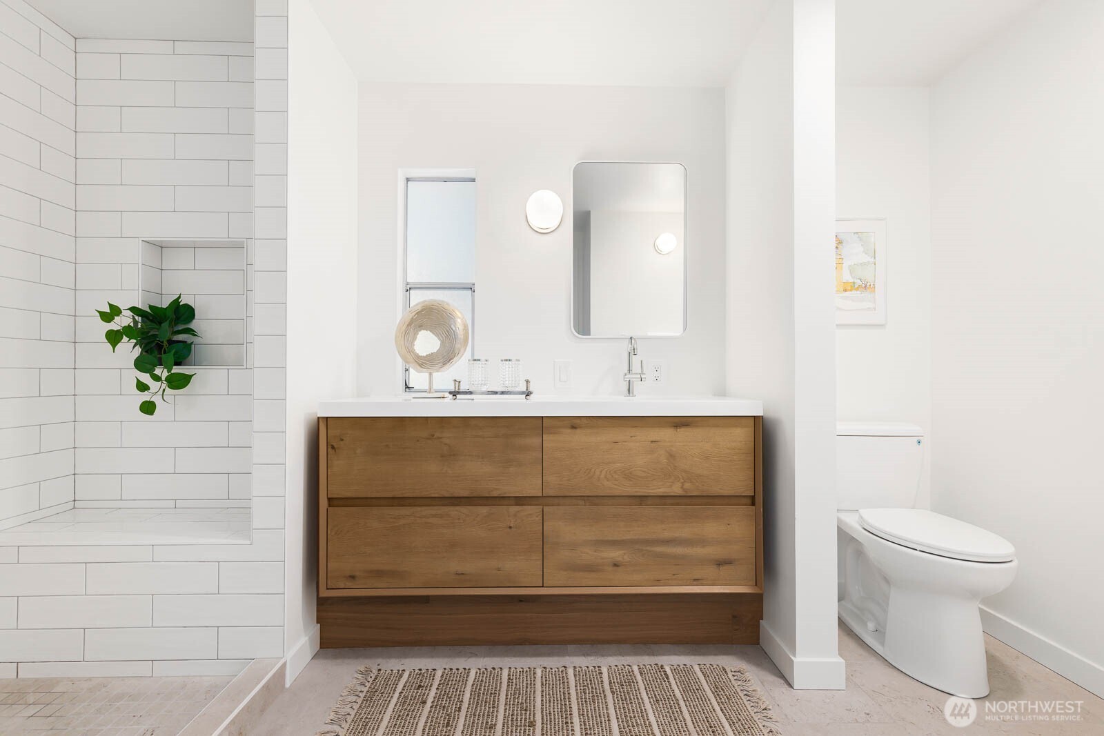 19425 Hollyhills Drive Northeast Bothell, WA 98011 - Photo 17 of 26 a bathroom with a sink a toilet and shower