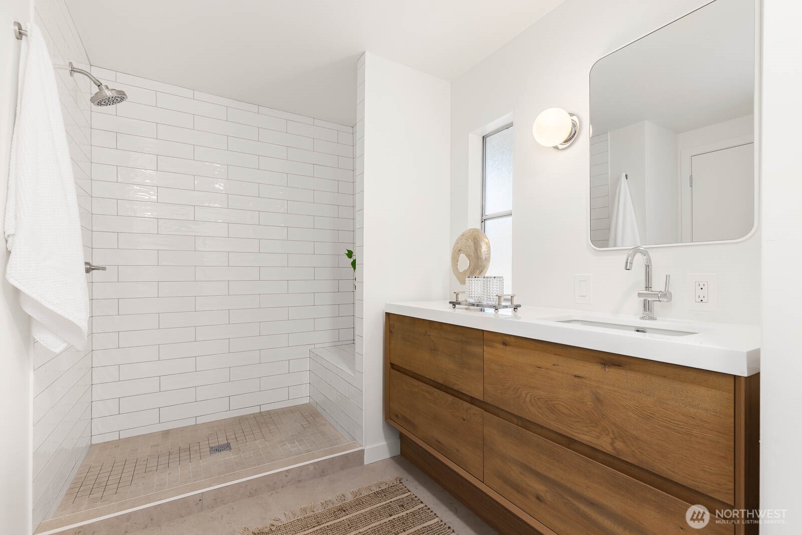 19425 Hollyhills Drive Northeast Bothell, WA 98011 - Photo 18 of 26 a bathroom with a sink and a mirror