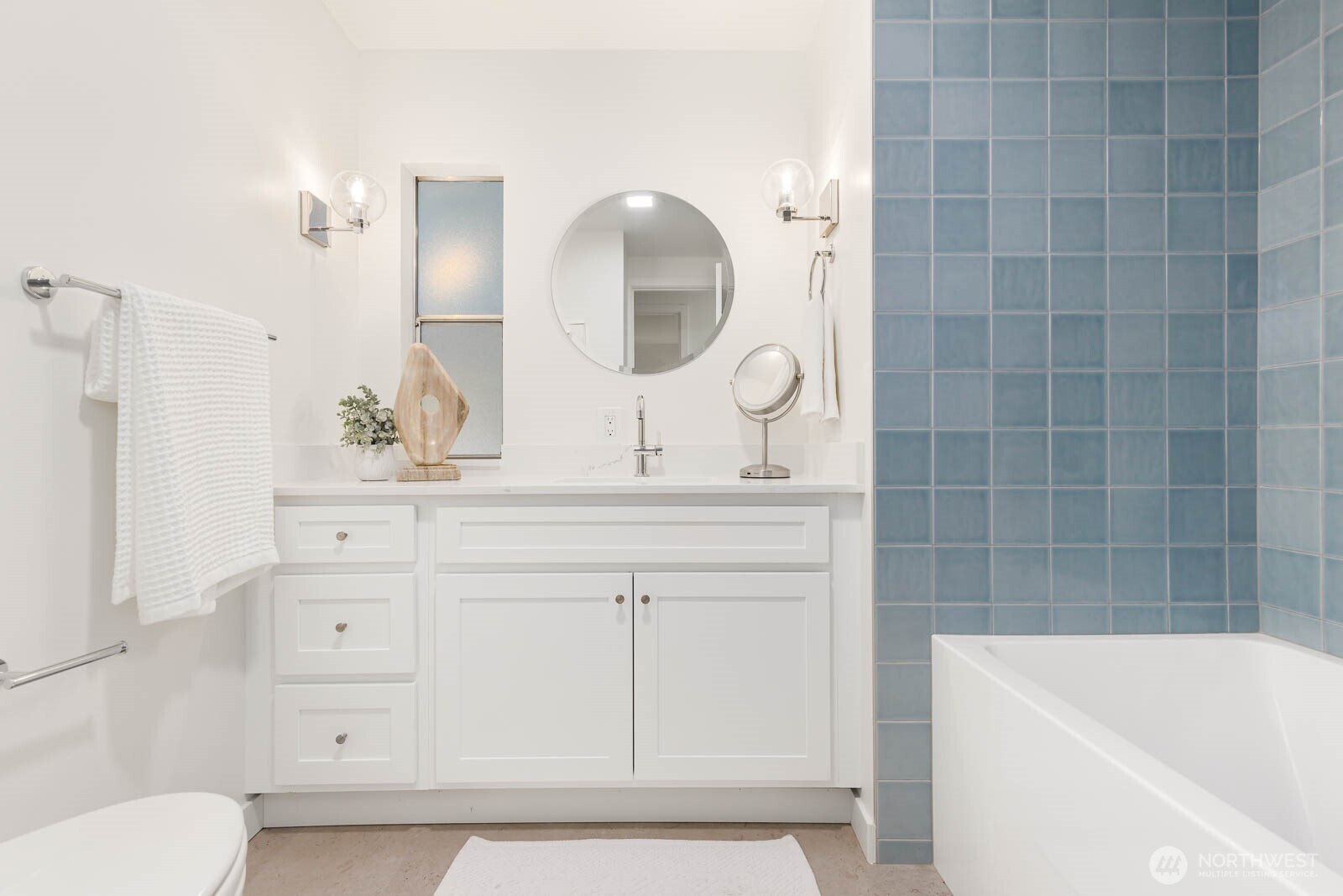 19425 Hollyhills Drive Northeast Bothell, WA 98011 - Photo 21 of 26 a bathroom with a sink a toilet and bathtub