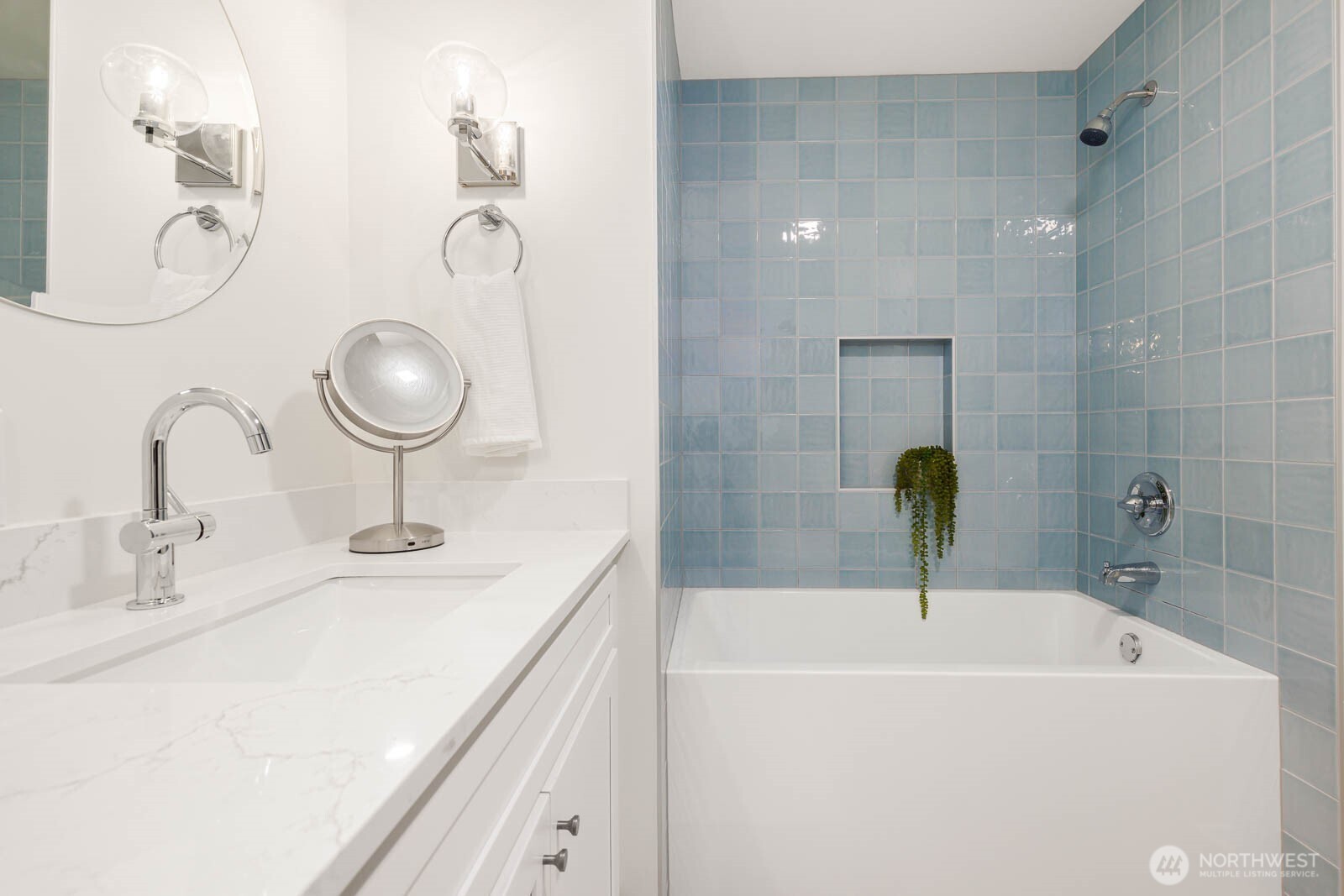 19425 Hollyhills Drive Northeast Bothell, WA 98011 - Photo 22 of 26 a bathroom with a sink and a mirror