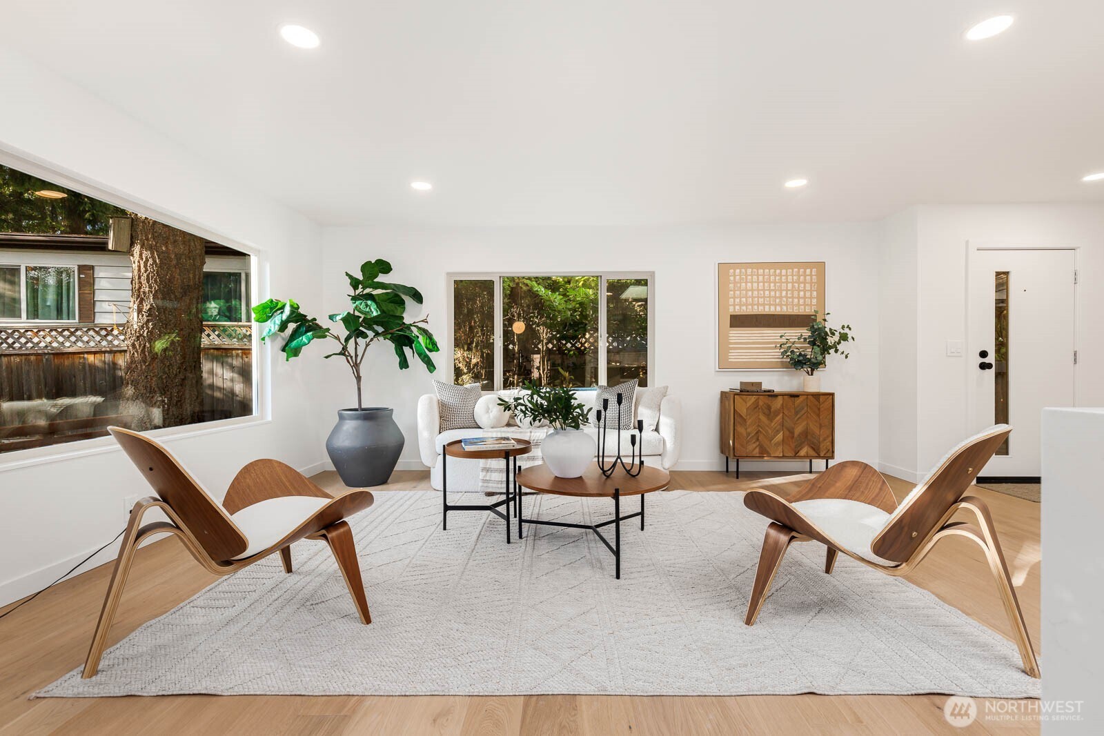 19425 Hollyhills Drive Northeast Bothell, WA 98011 - Photo 6 of 26 a living room with furniture and a rug