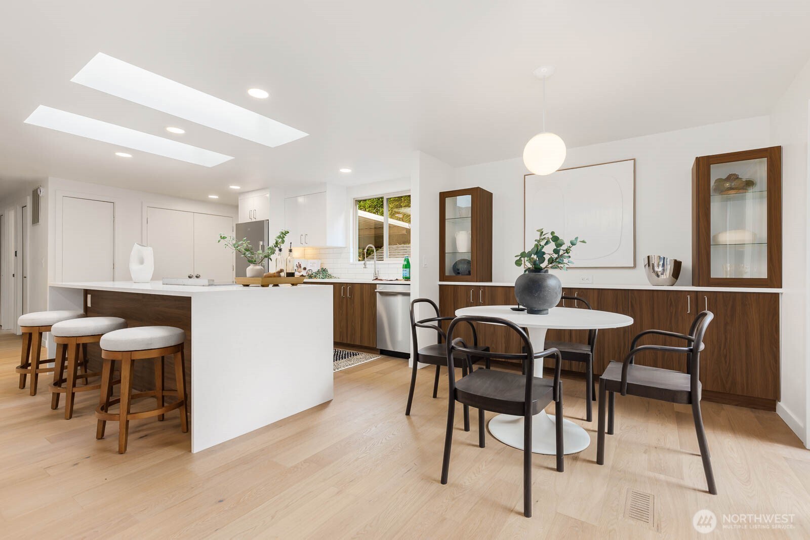19425 Hollyhills Drive Northeast Bothell, WA 98011 - Photo 9 of 26 a view of a dining room with furniture and wooden floor