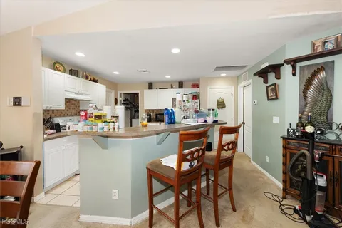 a kitchen with a table and chairs in it