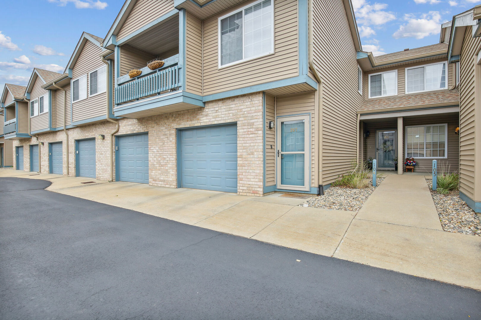 2404 Windward Boulevard, Unit 104 Champaign, IL 61821 - Photo 2 of 14 a house with a outdoor space