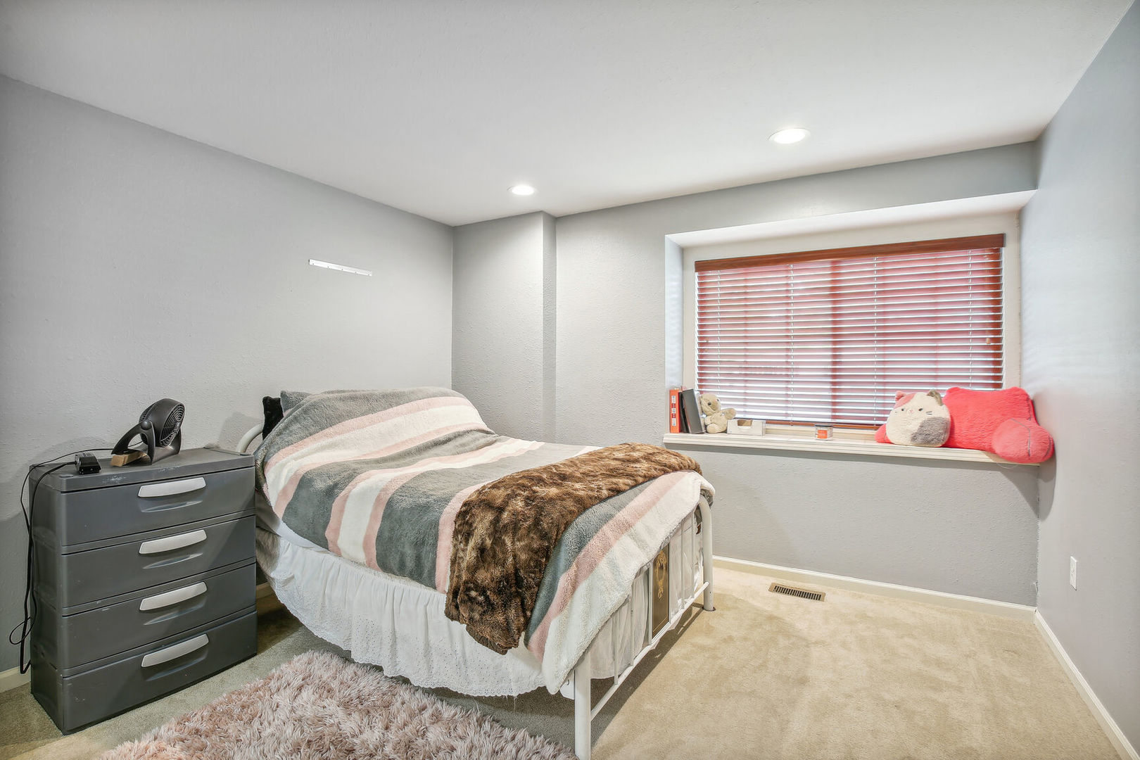 2404 Windward Boulevard, Unit 104 Champaign, IL 61821 - Photo 6 of 14 a spacious bedroom with a bed and a window