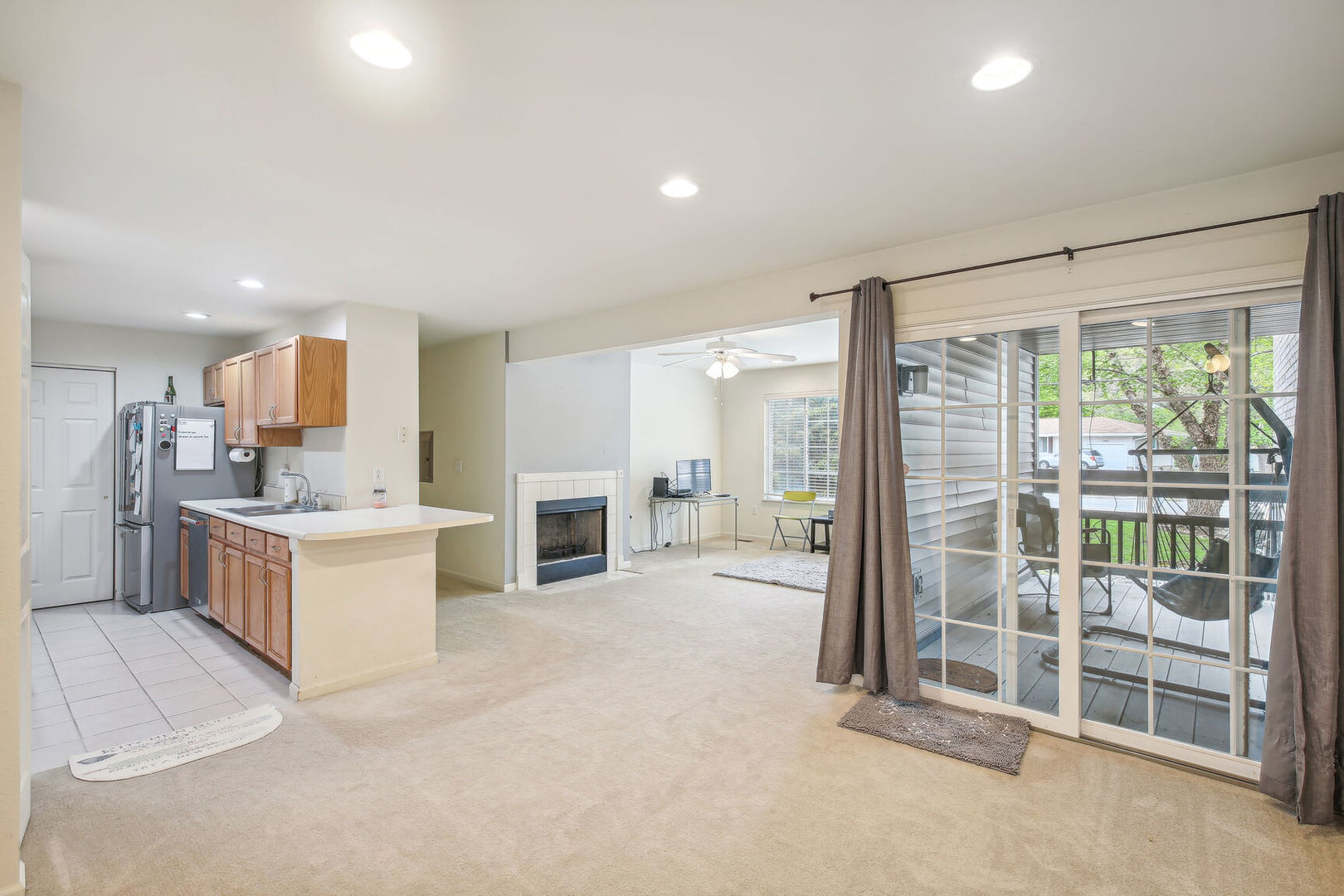 2404 Windward Boulevard, Unit 104 Champaign, IL 61821 - Photo 7 of 14 a large white kitchen with a large window and kitchen view