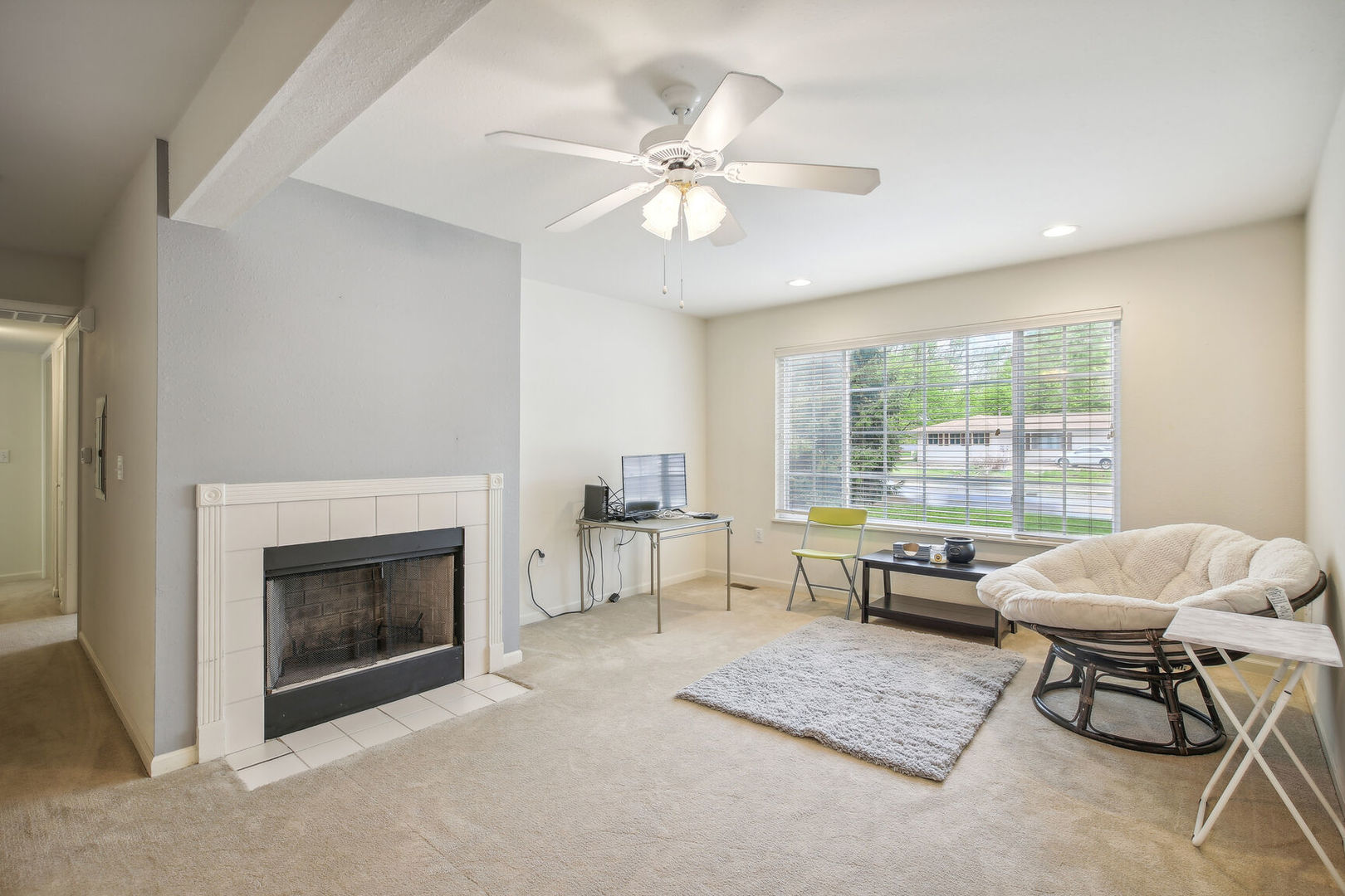 2404 Windward Boulevard, Unit 104 Champaign, IL 61821 - Photo 8 of 14 a living room with furniture and a fireplace