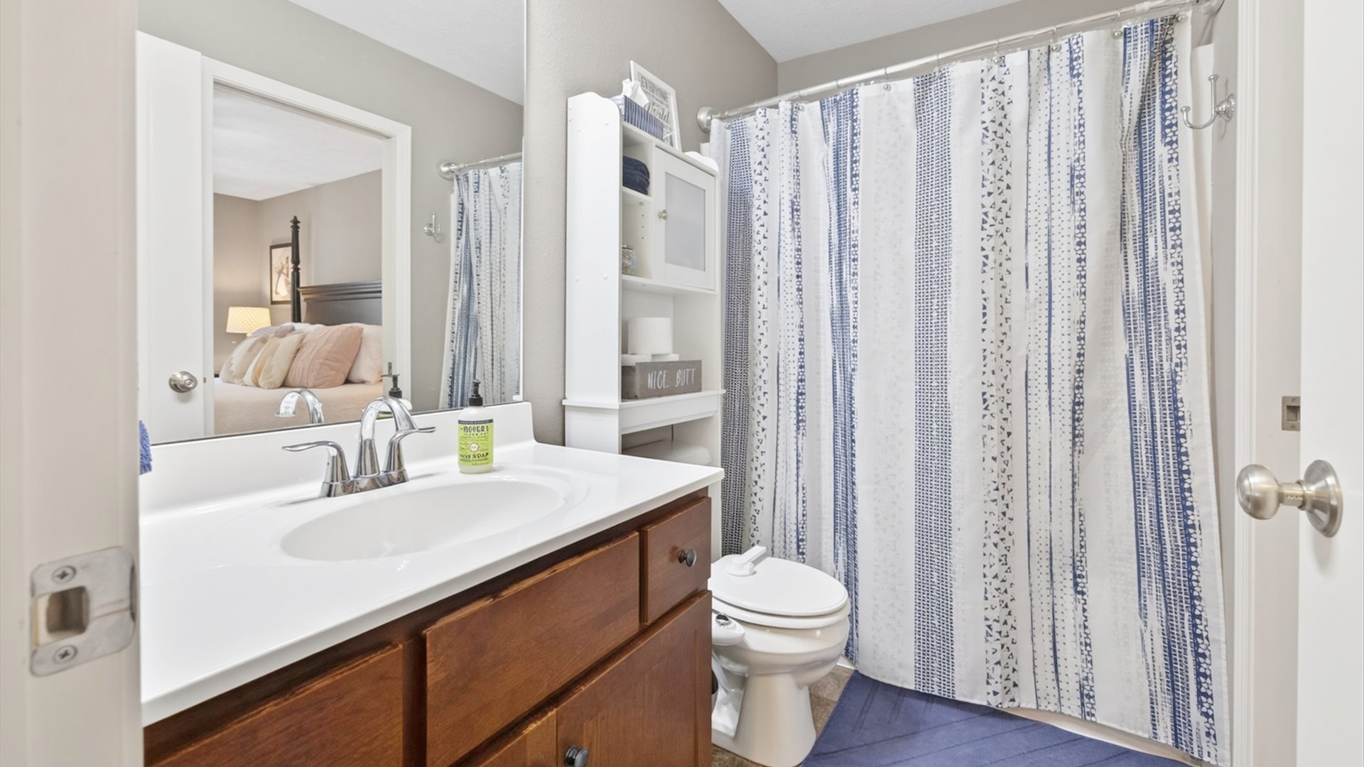 308 East Locust Street Normal, IL 61761 - Photo 17 of 40 a bathroom with a sink a toilet and shower curtain