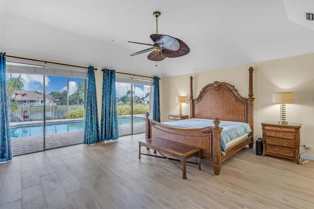 a bathroom with a granite countertop sink and a large mirror