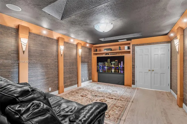 a view of a house with swimming pool and sitting area