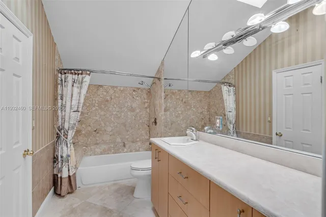 a view of a house with swimming pool and sitting area