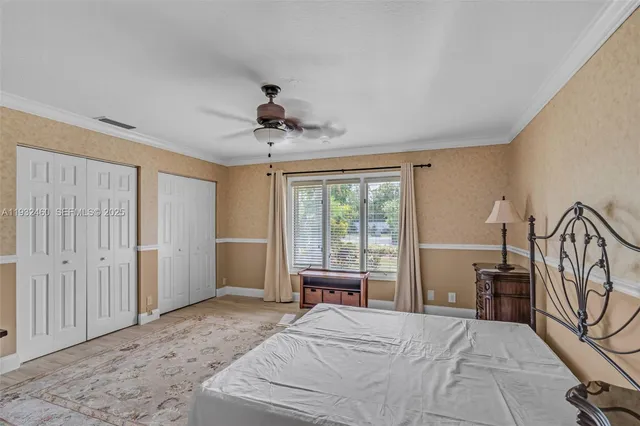 a view of swimming pool with a yard and potted plants