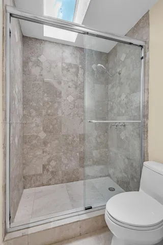 an aerial view of a house with a lake view