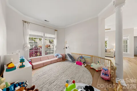 a living room with furniture and toys