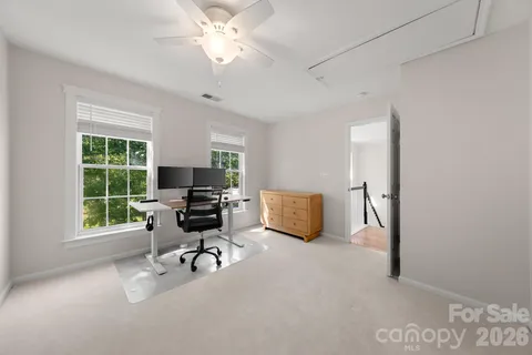 a work room with furniture and a window