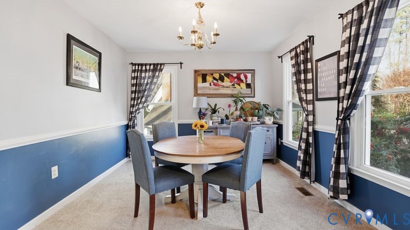 14607 Chatmoss Court Midlothian, VA 23112 - Photo 15 of 41 a view of a dining room with furniture and a chandelier
