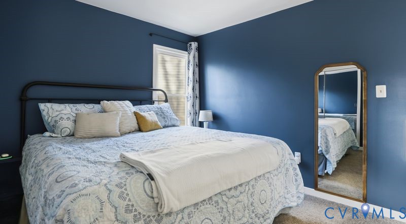 14607 Chatmoss Court Midlothian, VA 23112 - Photo 18 of 41 a bedroom with a bed and a mirror