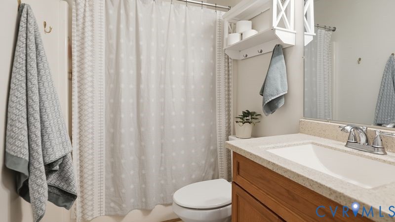 14607 Chatmoss Court Midlothian, VA 23112 - Photo 29 of 41 a bathroom with a sink a toilet and shower curtain