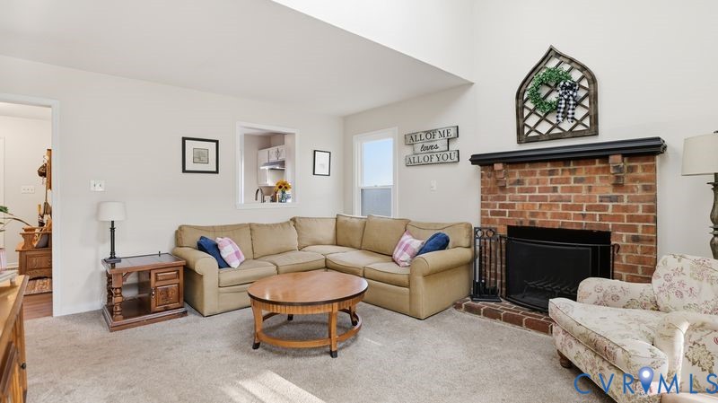 14607 Chatmoss Court Midlothian, VA 23112 - Photo 7 of 41 a living room with furniture a fireplace and a wall painting