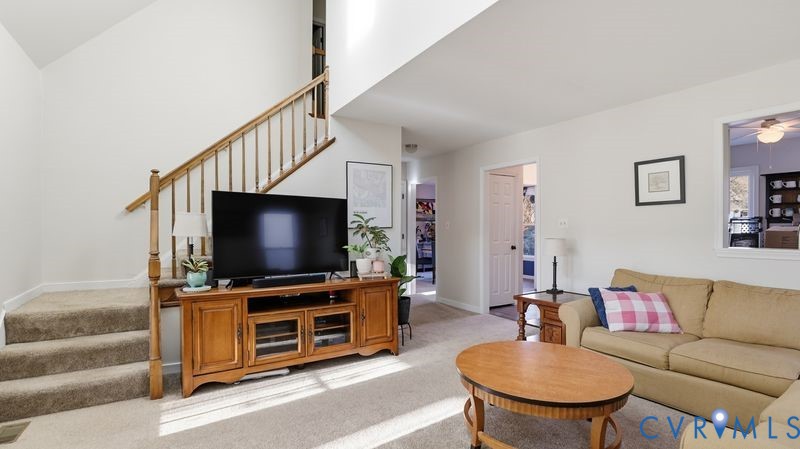 14607 Chatmoss Court Midlothian, VA 23112 - Photo 8 of 41 a living room with furniture and a flat screen tv