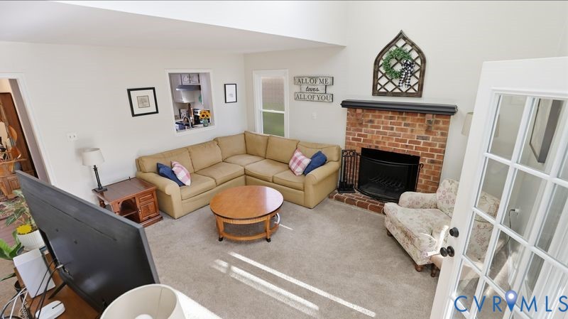 14607 Chatmoss Court Midlothian, VA 23112 - Photo 10 of 41 a living room with furniture and a fireplace