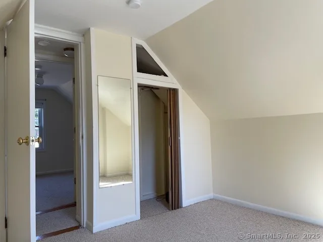 a view of hallway with sink and closet