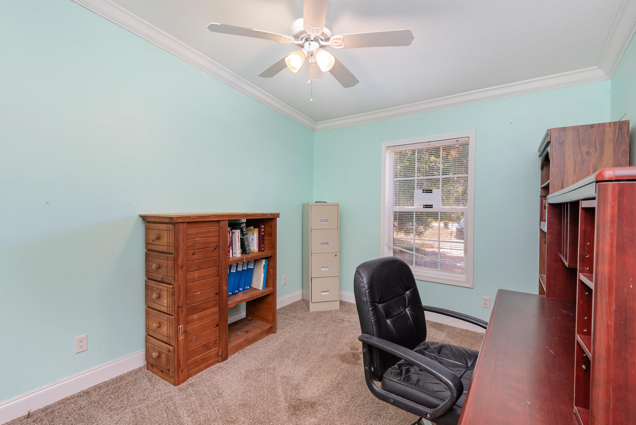 4850 Harrison Road Mims, FL 32754 - Photo 13 of 28 a living room with furniture and a bookshelf