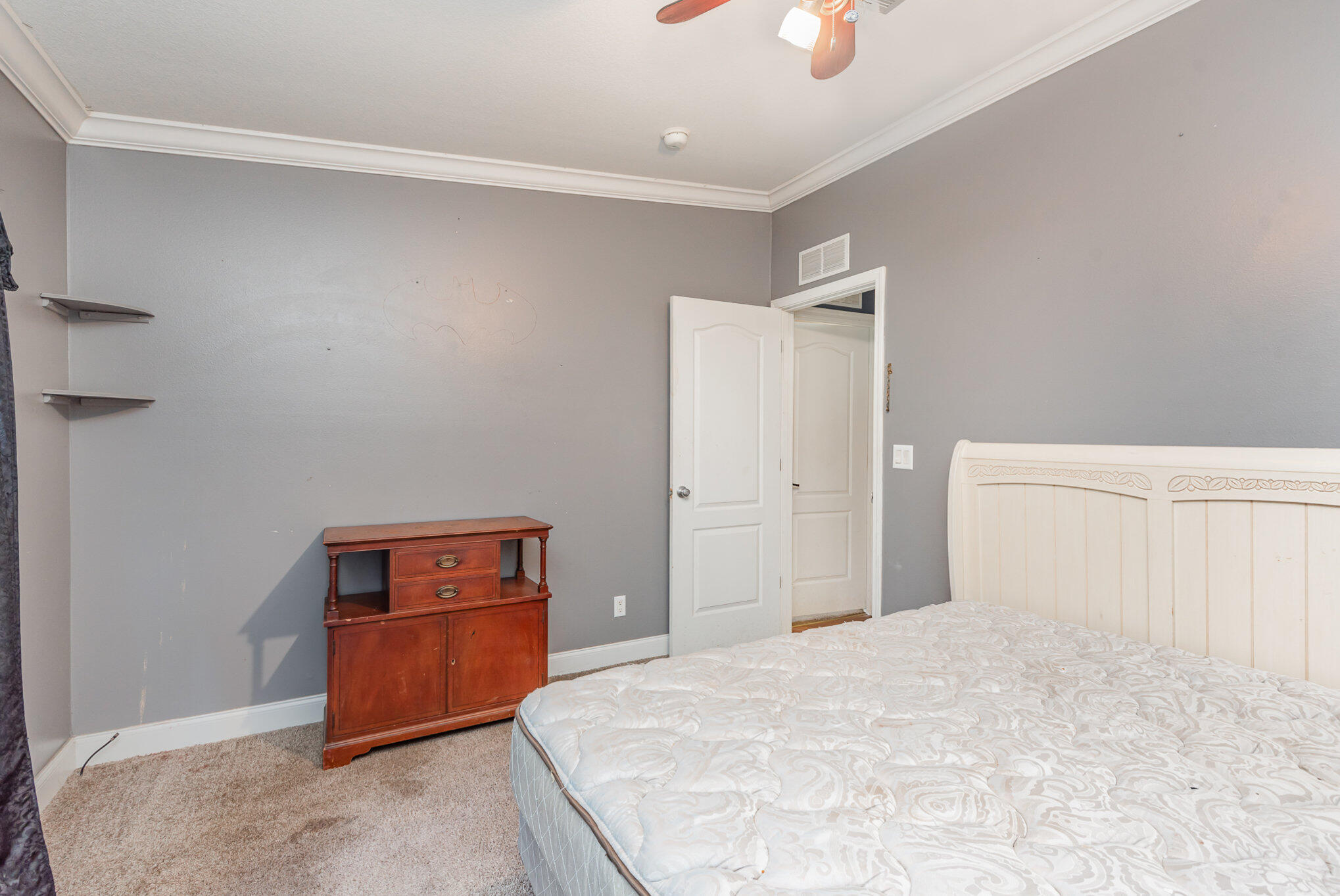 4850 Harrison Road Mims, FL 32754 - Photo 16 of 28 a bedroom with a bed and a chandelier