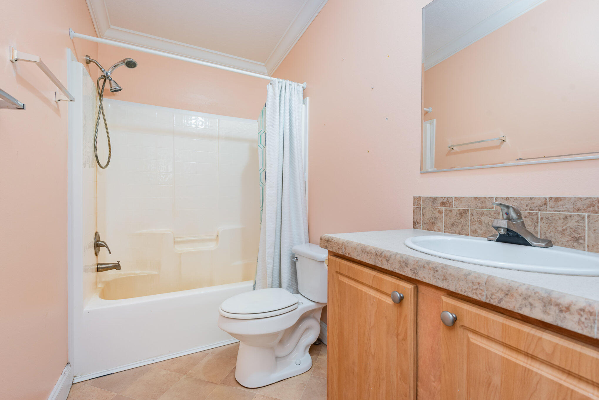 4850 Harrison Road Mims, FL 32754 - Photo 21 of 28 a bathroom with a granite countertop sink toilet and shower
