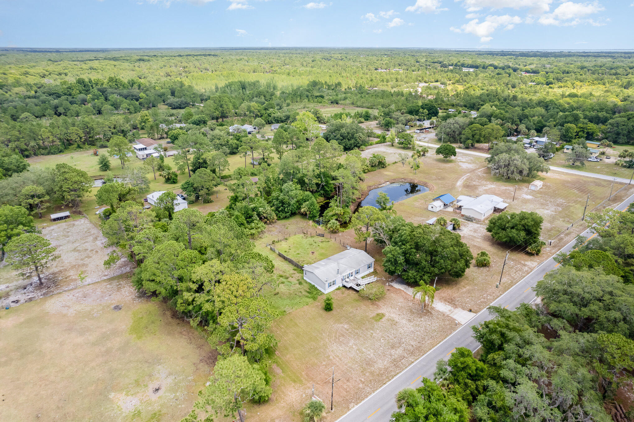 4850 Harrison Road Mims, FL 32754 - Photo 27 of 28 an aerial view of a city with lots of residential buildings and mountain view in back