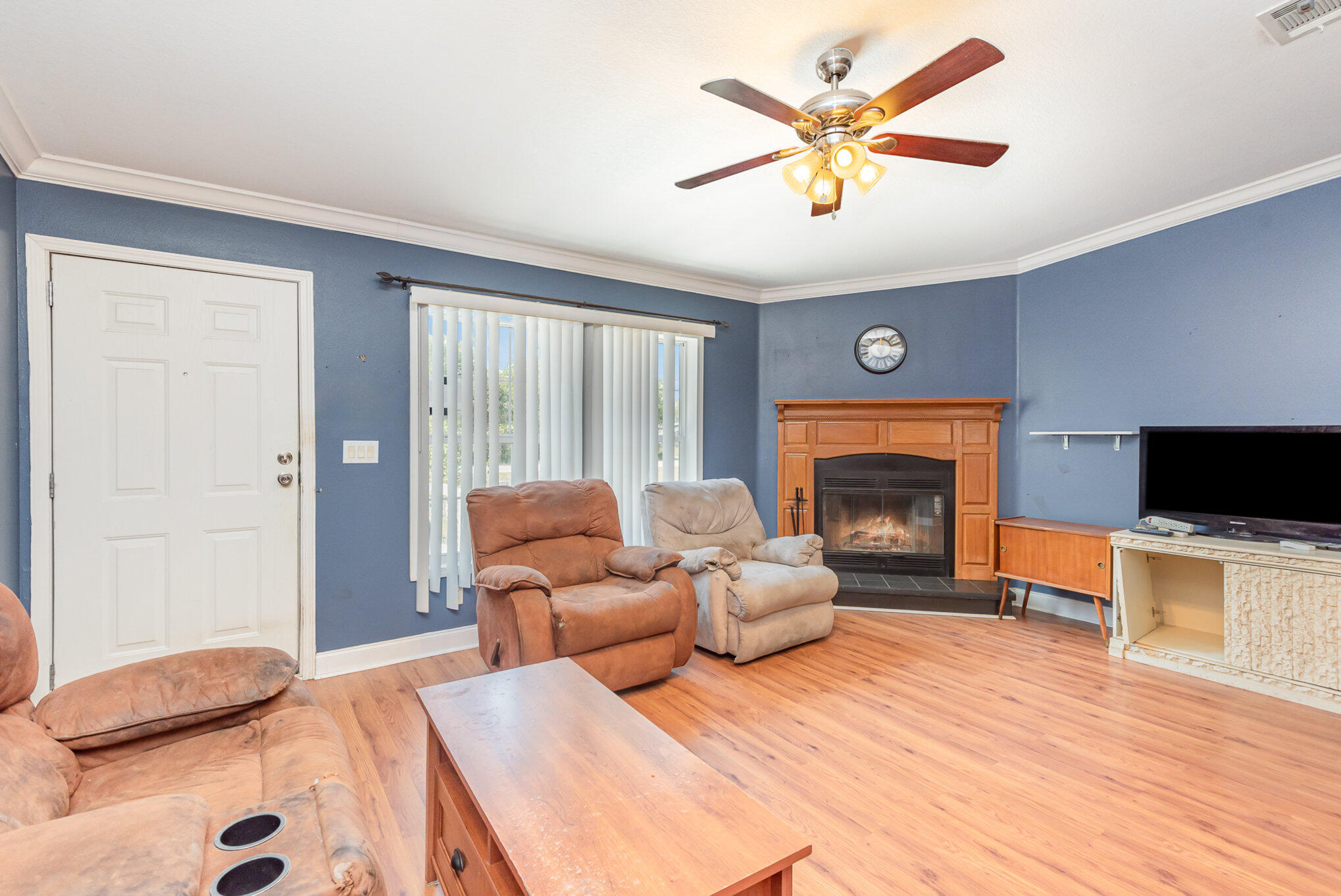 4850 Harrison Road Mims, FL 32754 - Photo 5 of 28 a bedroom with a bed and a fireplace