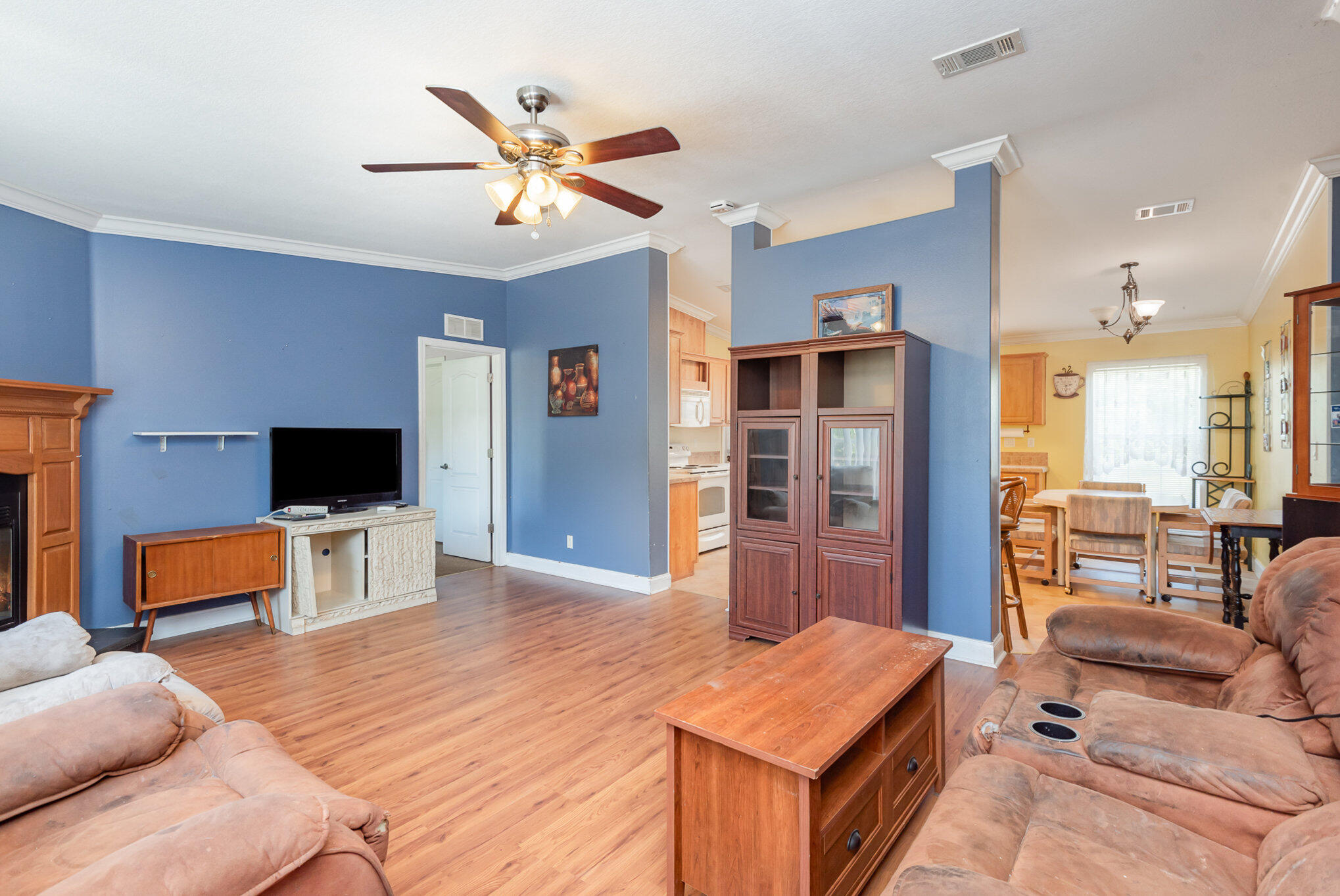 4850 Harrison Road Mims, FL 32754 - Photo 6 of 28 a living room with furniture and a flat screen tv
