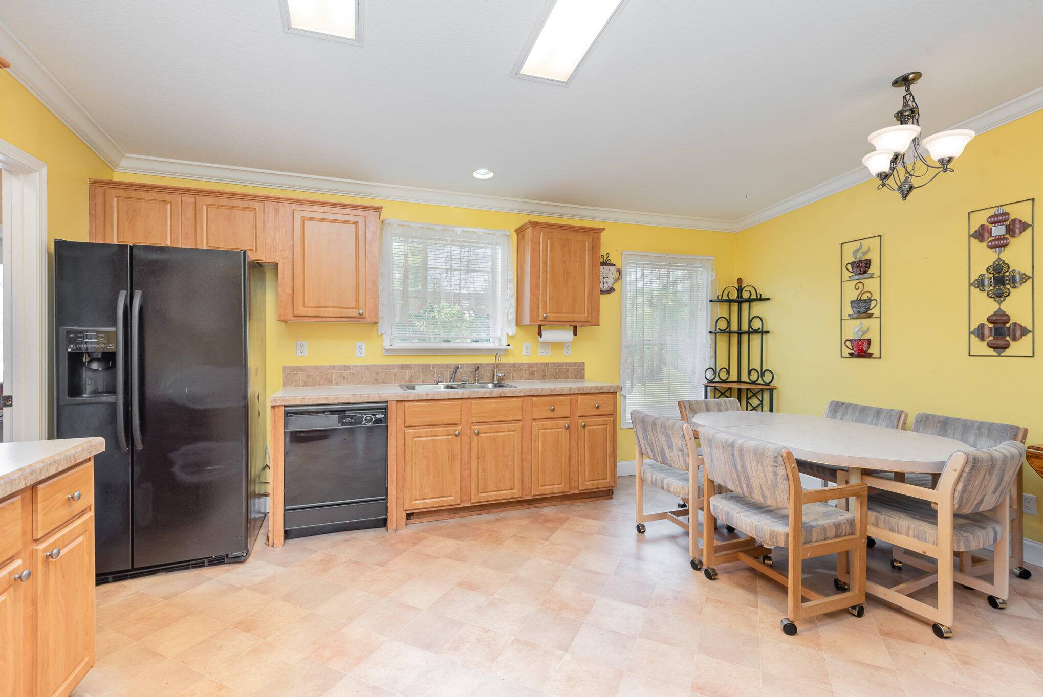 4850 Harrison Road Mims, FL 32754 - Photo 8 of 28 a kitchen with a refrigerator and a sink