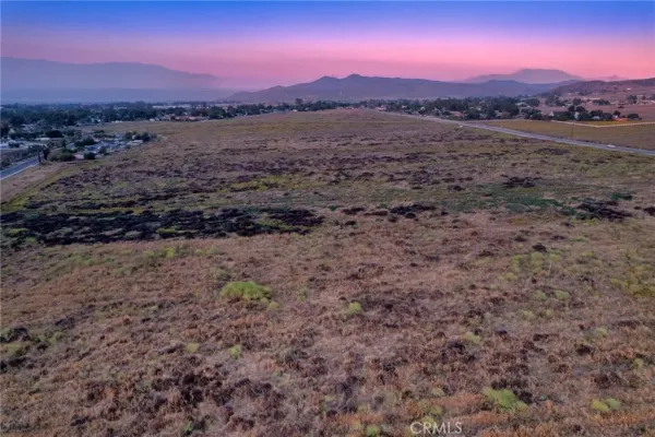a view of a yard with a mountain