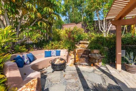 a view of outdoor sitting area with furniture and wooden floor