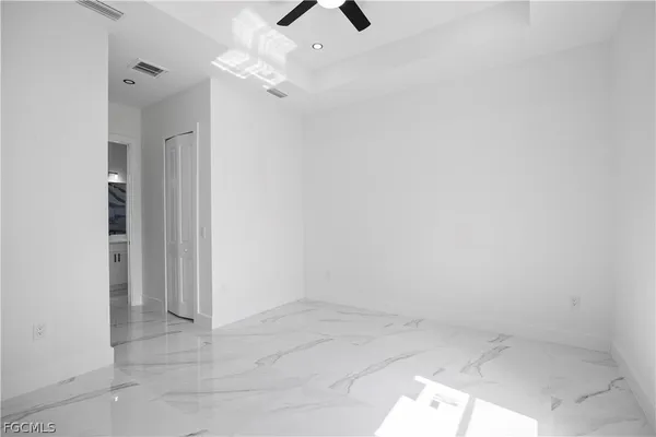 a view of kitchen with stainless steel appliances cabinets