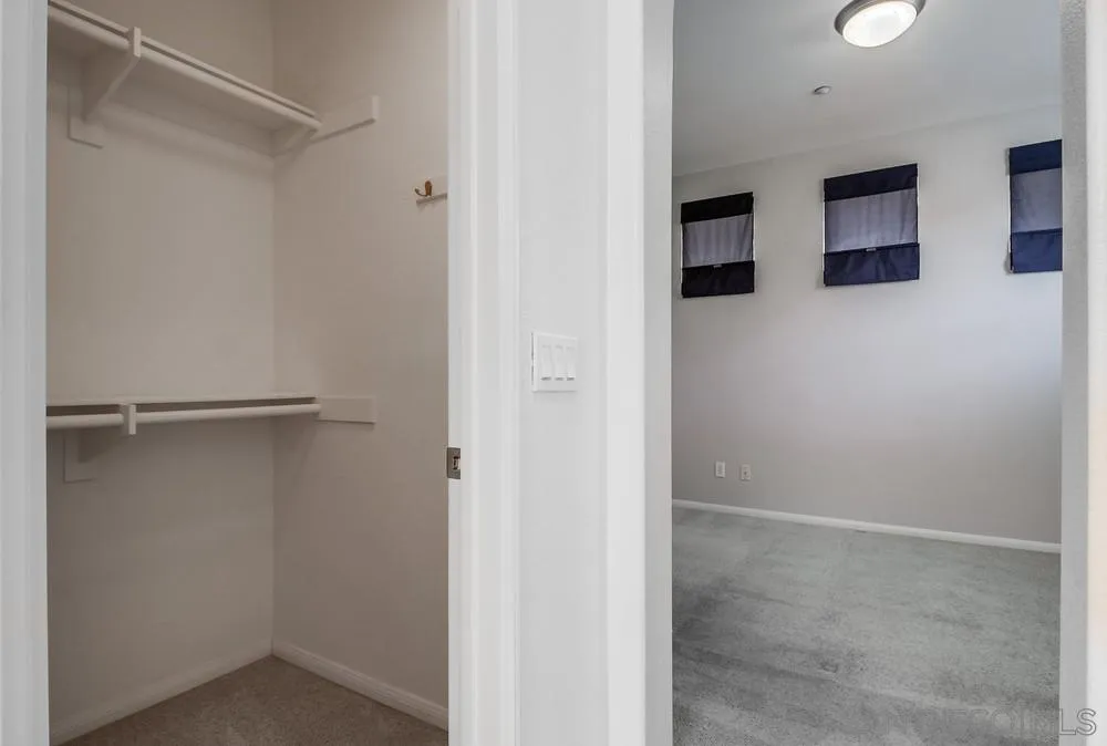 1298 Fools Gold Way, Unit 4 Chula Vista, CA 91913 - Photo 26 of 38 a view of a hallway with closet