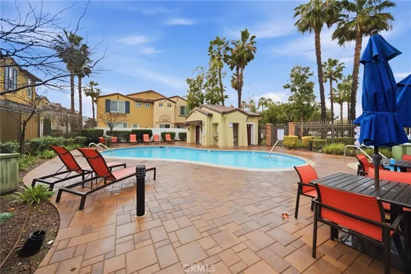 swimming pool with table and chairs