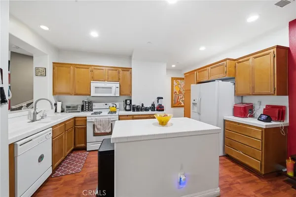a utility room with cabinets washer and dryer