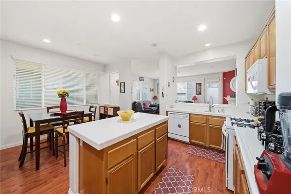 a kitchen that has a table and chairs in it