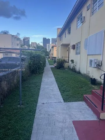 a front view of a house with yard